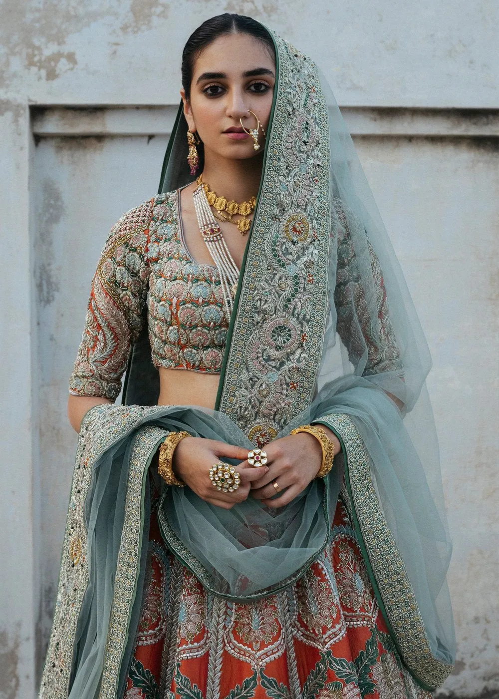 Latest silk embroidered lehnga in orange color for wedding wear # B3409