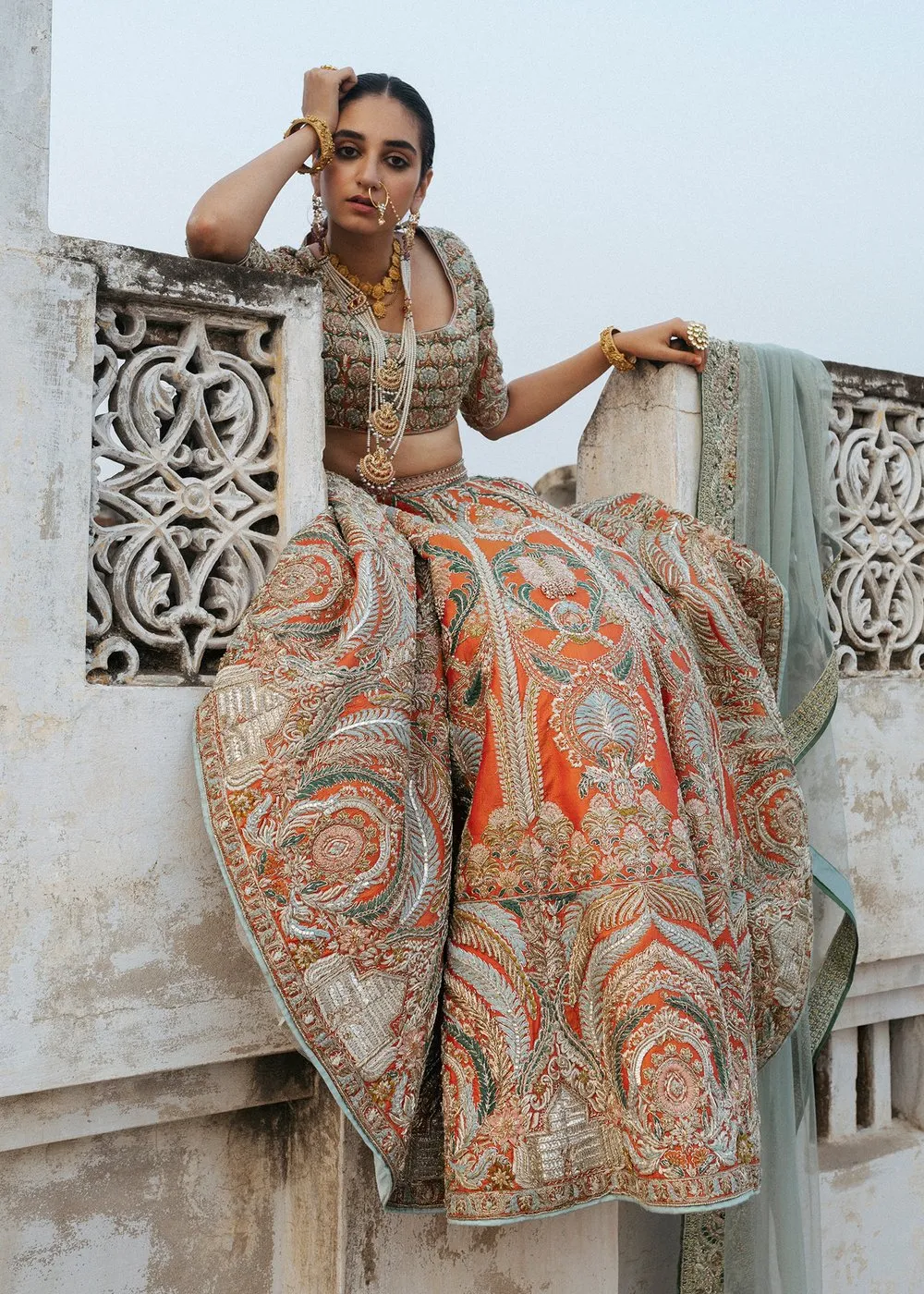 Latest silk embroidered lehnga in orange color for wedding wear # B3409