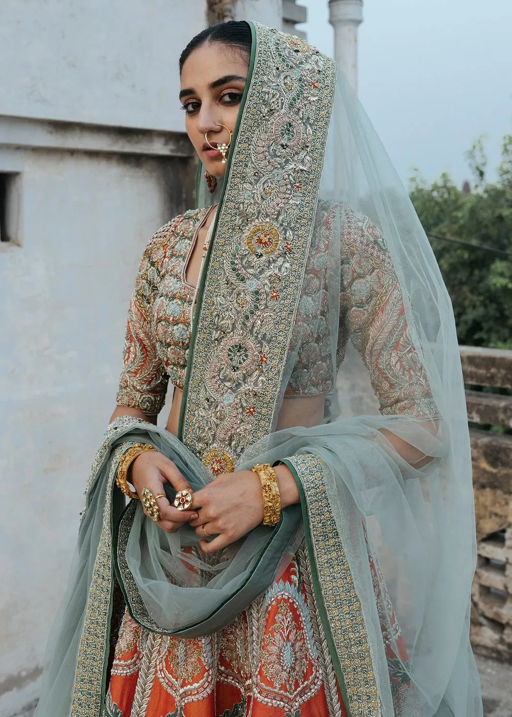 Latest silk embroidered lehnga in orange color for wedding wear # B3409